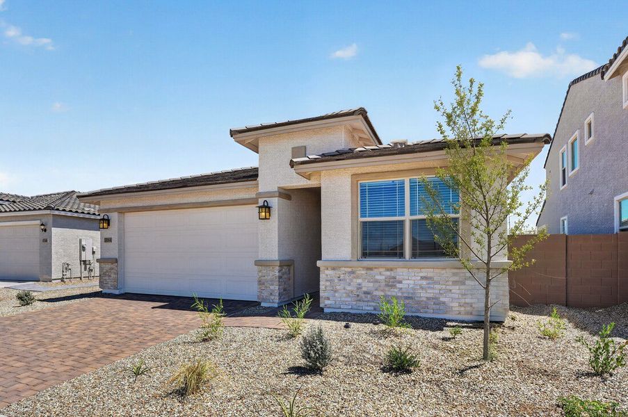 Front exterior of a new home in Artisan at Asante, Surprise, AZ, highlighting curb appeal (Image 19).