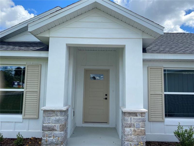 Front exterior of a new home in , Ocala, FL, highlighting curb appeal (Image 29).