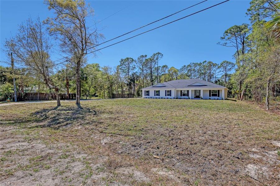 Front exterior of a new home in , Mims, FL, highlighting curb appeal (Image 2).