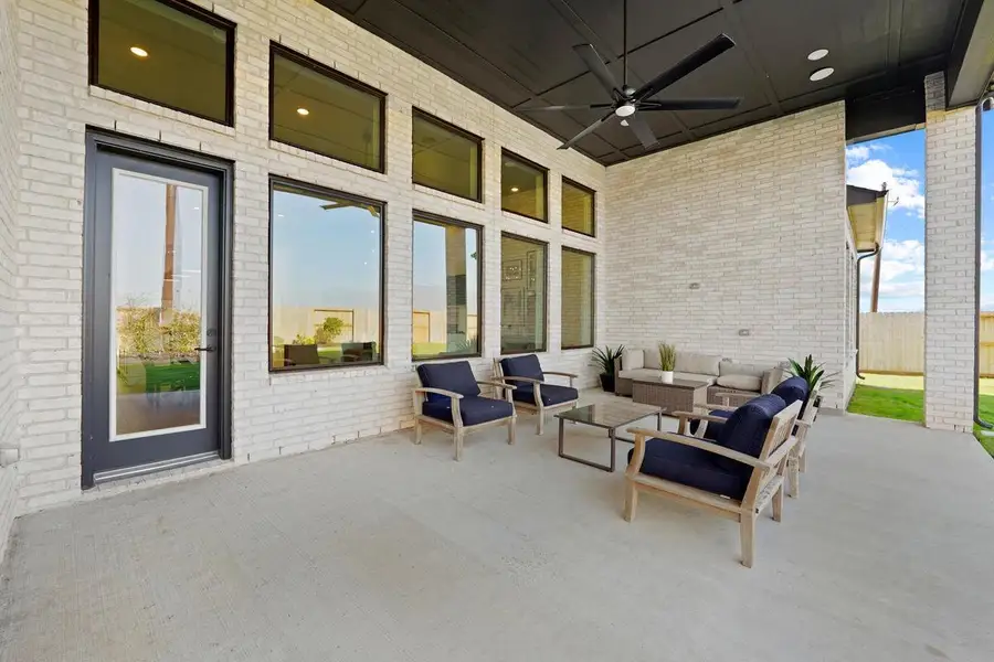 Exterior details and patio area of a home in Dunham Pointe 70', Cypress (Image 1). Exterior details and patio area of a home in Dunham Pointe 70', Cypress (Image 1).