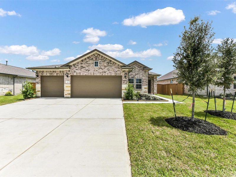Front exterior of a new home in River Ranch Meadows, Dayton, TX, highlighting curb appeal (Image 2). Front exterior of a new home in River Ranch Meadows, Dayton, TX, highlighting curb appeal (Image 2).