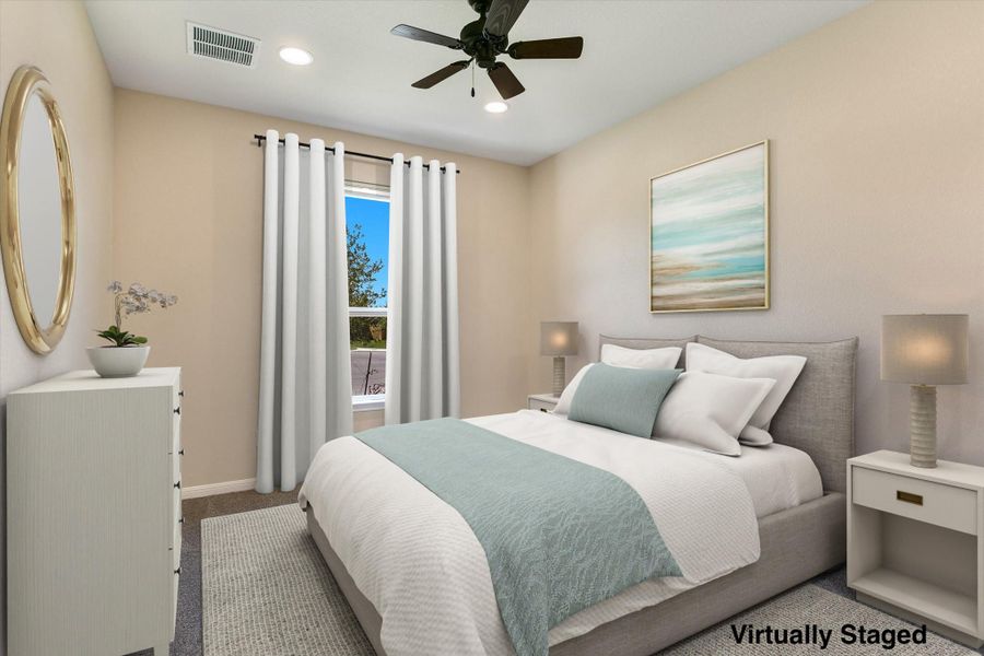Virtually staged, this front bedroom offers an en-suite bathroom and a walk-in closet.