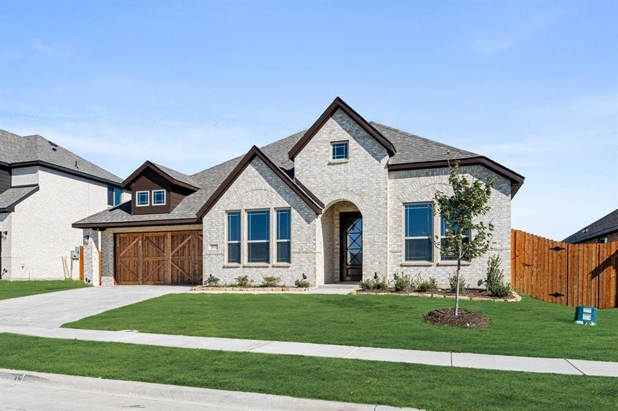 Front exterior of a new home in The Retreat at North Grove 60, Waxahachie, TX, highlighting curb appeal (Image 16). Front exterior of a new home in The Retreat at North Grove 60, Waxahachie, TX, highlighting curb appeal (Image 16).