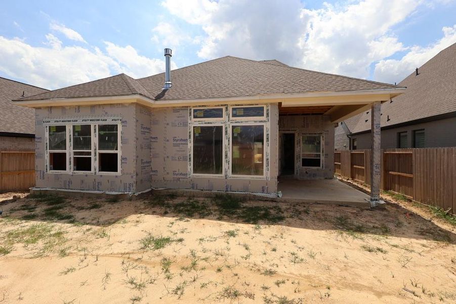 Front exterior of a new home in Riceland 50’ Front Load Homesites, Mont Belvieu, TX, highlighting curb appeal (Image 7).
