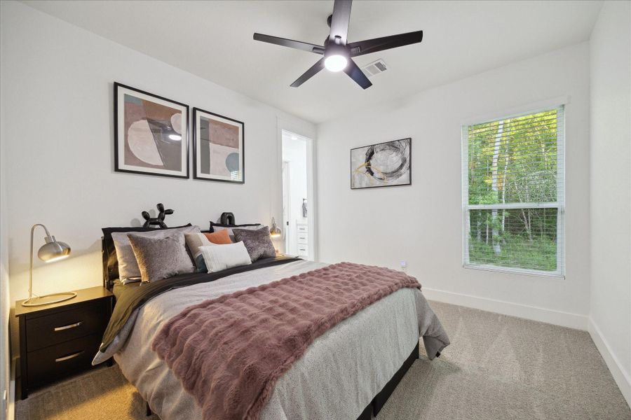 Secondary Bedroom with carpet and a ceiling fan Secondary Bedroom with carpet and a ceiling fan