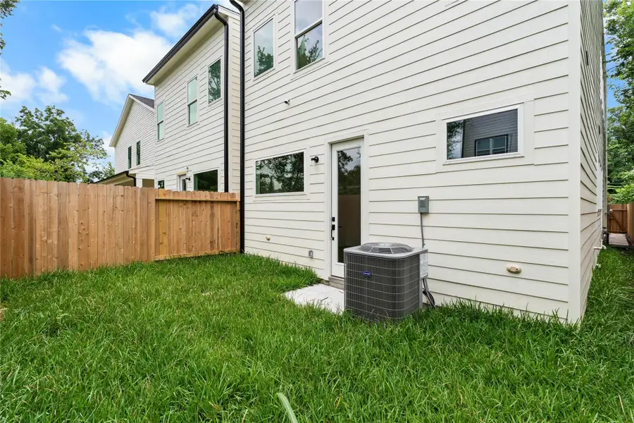 Private backyard with full fencing, green space, and direct access from the main level Private backyard with full fencing, green space, and direct access from the main level