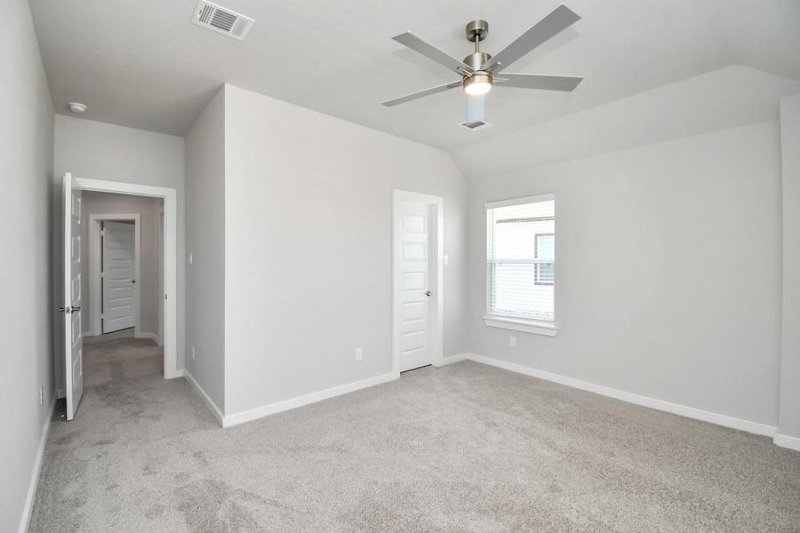 Generously sized secondary bedrooms featuring spacious closets, soft and inviting carpeting underfoot, large windows allowing plenty of natural light, and the added touch of privacy blinds for your personal retreat. Sample photo of completed home with similar floor plan. Actual colors and selections may vary.