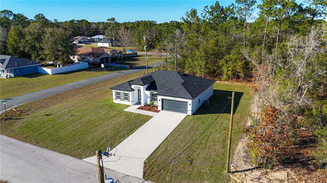 Front exterior of a new home in , Citrus Springs, FL, highlighting curb appeal (Image 26).
