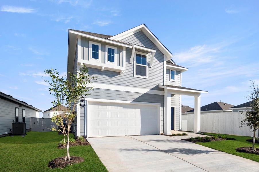 Front exterior of a new home in Harvest Ridge, Elgin, TX, highlighting curb appeal (Image 2). Front exterior of a new home in Harvest Ridge, Elgin, TX, highlighting curb appeal (Image 2).