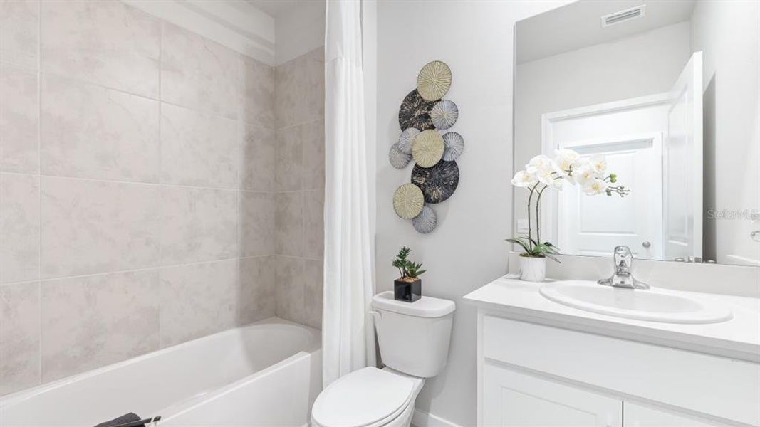 Furnished interior view inside a new home in Halifax Plantation Villas, Ormond Beach (Image 11).
