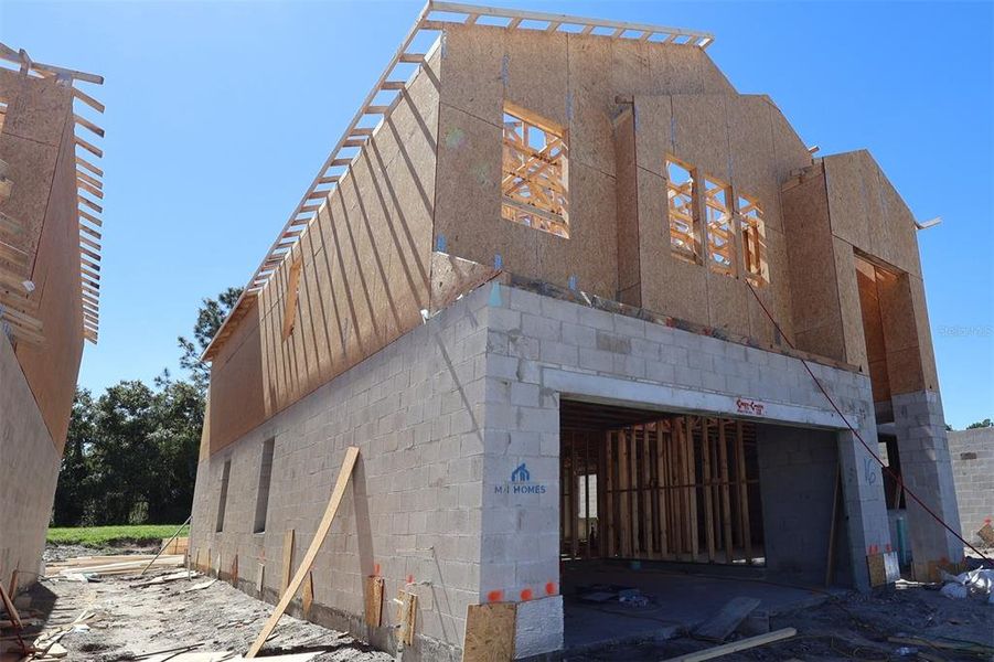 In-progress construction of a new home in Eden at Crossprairie, St. Cloud, FL (Image 19).