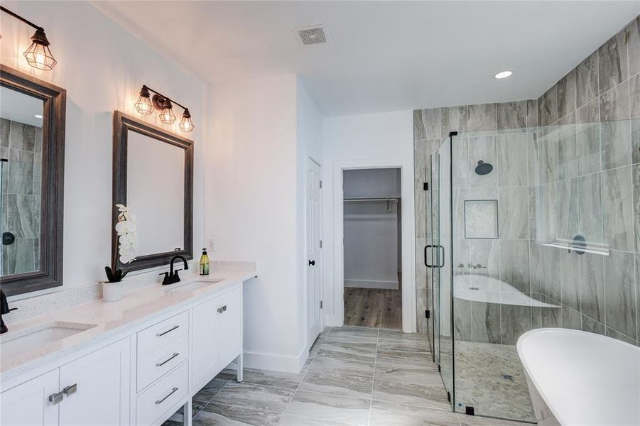 Bathroom with vanity and independent shower and bath