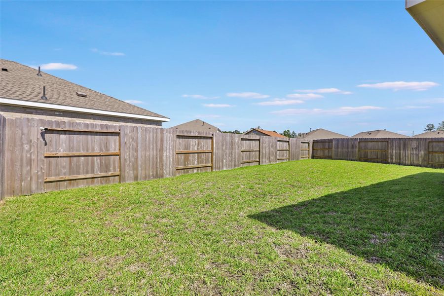 Exterior details and patio area of a home in Tavola, New Caney (Image 17).