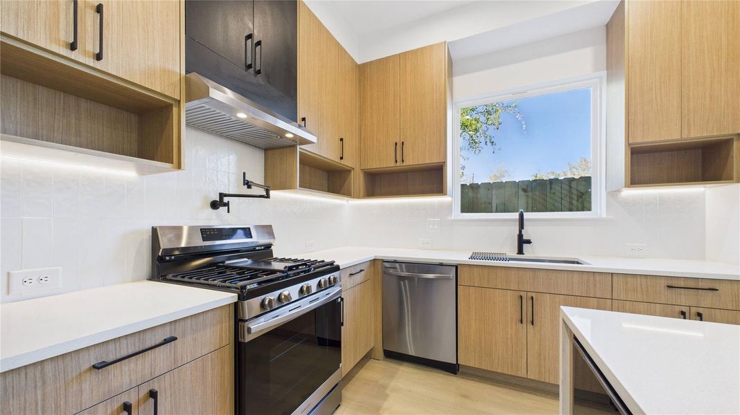 Kitchen under cabinet lighting and pot filler