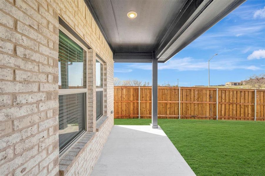 Exterior details and patio area of a home in Aspire at Reunion, Newark (Image 22).