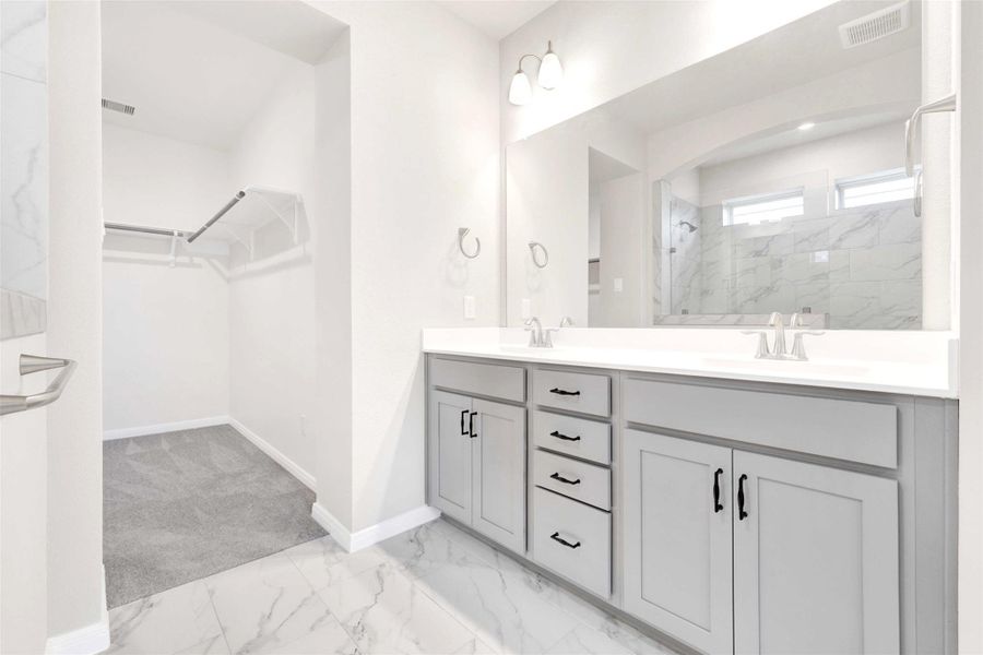 Custom hardware on bathroom cabinets