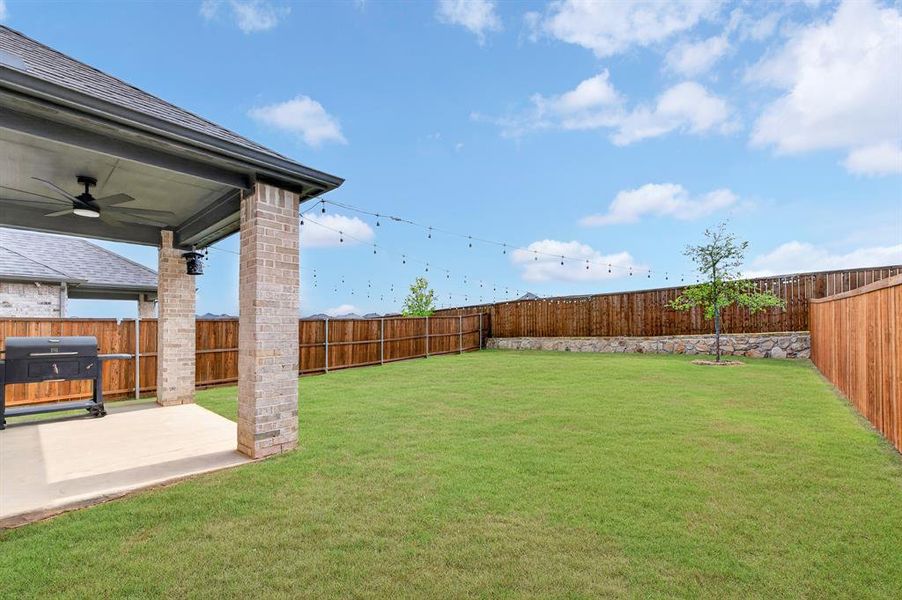 Exterior details and patio area of a home in South Oak, Lakewood Village (Image 4).