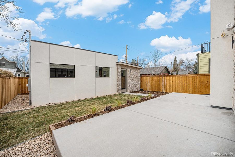 Mud room with built-in storage leads in from the garage