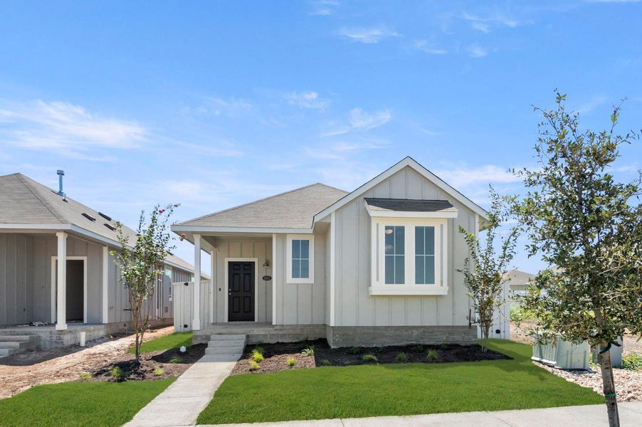 Front exterior of a new home in Casetta Ranch, Kyle, TX, highlighting curb appeal (Image 20).