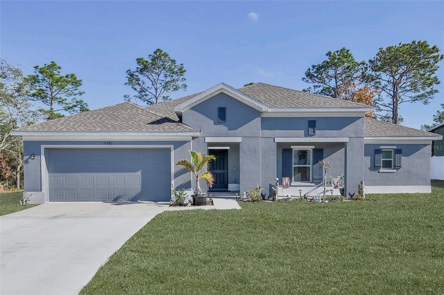 Front exterior of a new home in Royal Highlands, Brooksville, FL, highlighting curb appeal (Image 29).