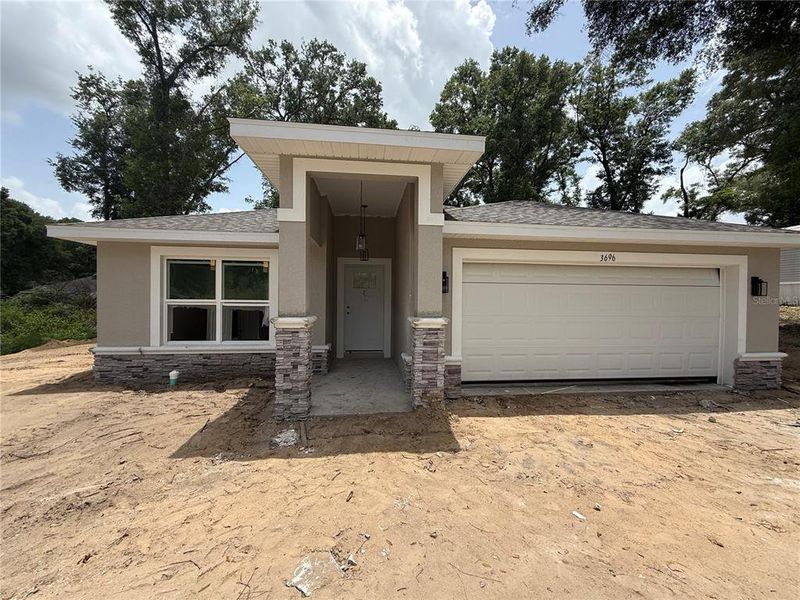 Front exterior of a new home in , Summerfield, FL, highlighting curb appeal (Image 2). Front exterior of a new home in , Summerfield, FL, highlighting curb appeal (Image 2).