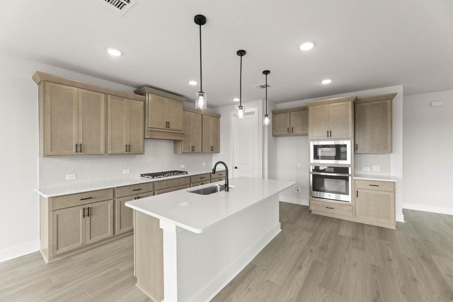 Representative furnished interior of a home built from the Magnolia by Tri Pointe Homes in Treeline, Justin (Image 8).