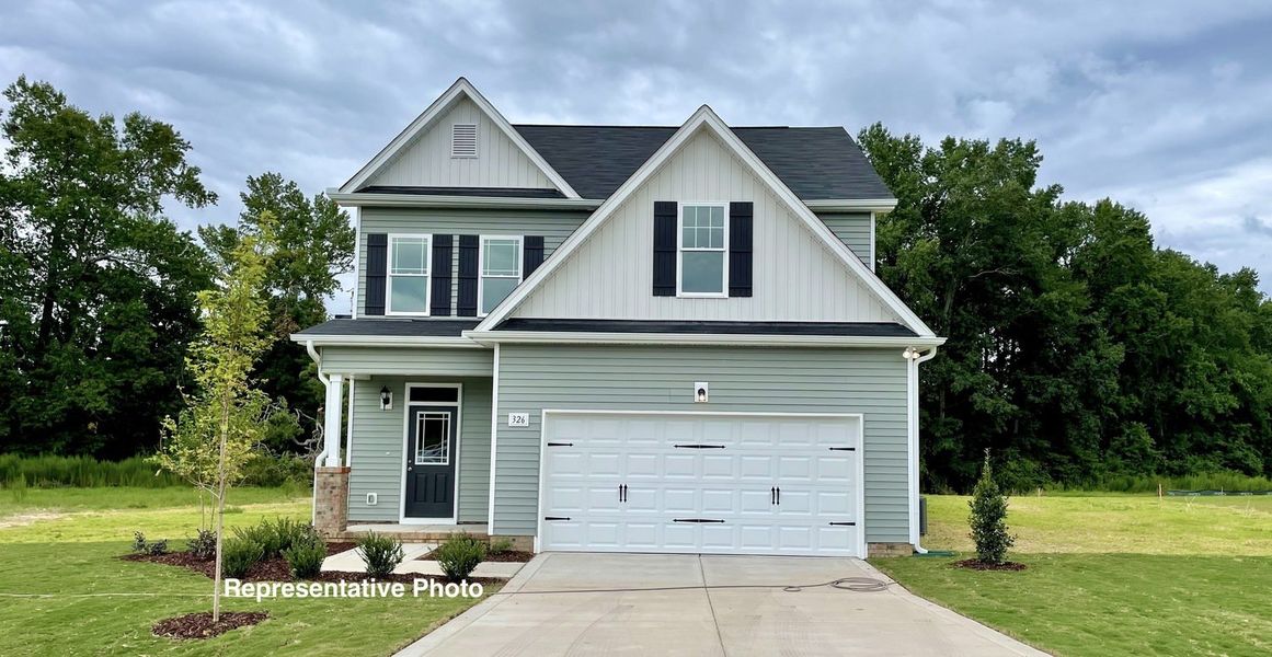 Representative exterior photo of a completed home built from the Palmer by RiverWILD Homes in Riverwood Ranch, Clayton, NC (Image 19).