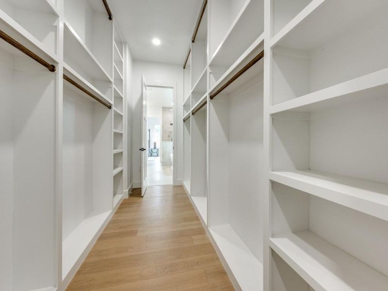 Spacious closet featuring light wood-type flooring