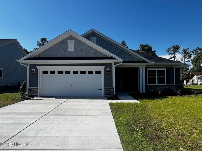 Front exterior of a new home in Rutledge, Shallotte, NC, highlighting curb appeal (Image 2). Front exterior of a new home in Rutledge, Shallotte, NC, highlighting curb appeal (Image 2).