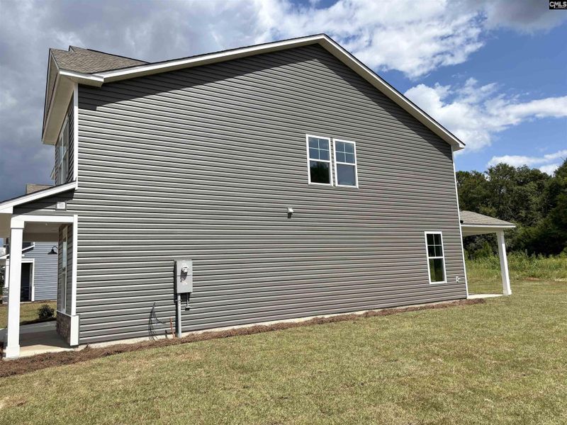 Front exterior of a new home in Rolling Hills, Prosperity, SC, highlighting curb appeal (Image 17).