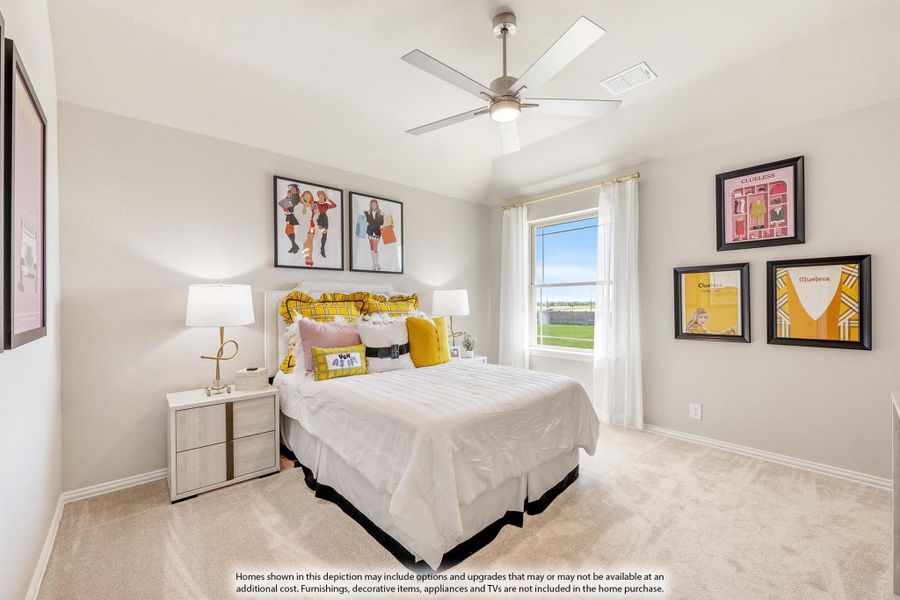 Bedroom with queen bed, ceiling fan, carpet flooring, and a window with white curtains Bedroom with queen bed, ceiling fan, carpet flooring, and a window with white curtains