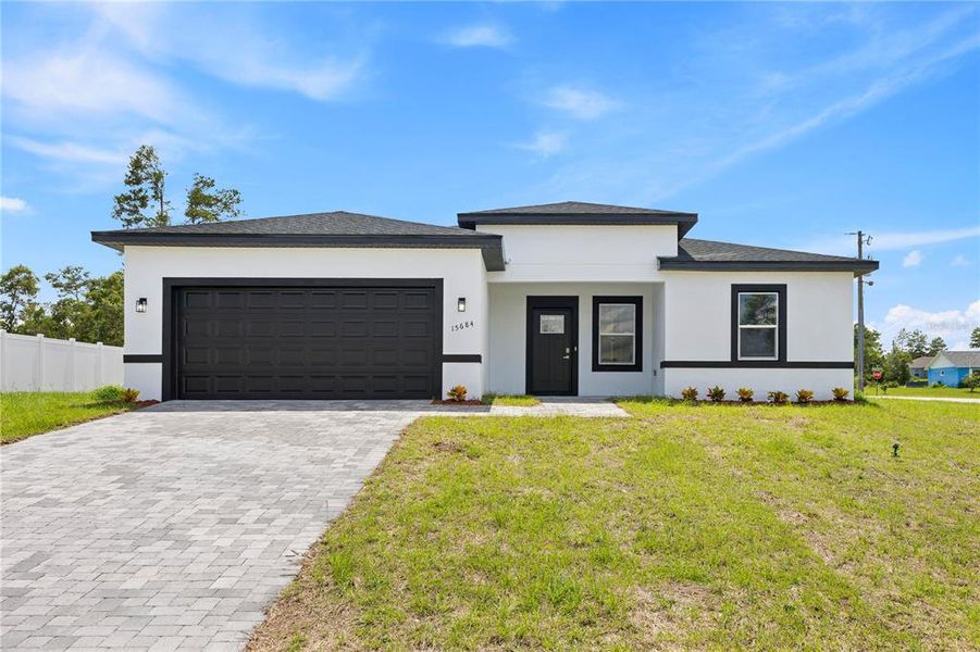 Front exterior of a new home in , Ocala, FL, highlighting curb appeal (Image 1). Front exterior of a new home in , Ocala, FL, highlighting curb appeal (Image 1).