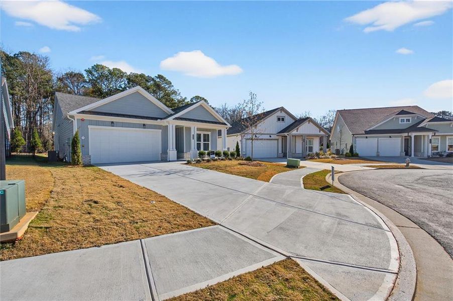 Front exterior of a new home in The Reserve at Bells Ferry, Kennesaw, GA, highlighting curb appeal (Image 21).