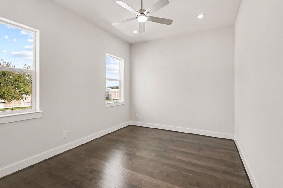 Light-filled secondary bedroom with modern finishes and generous space.