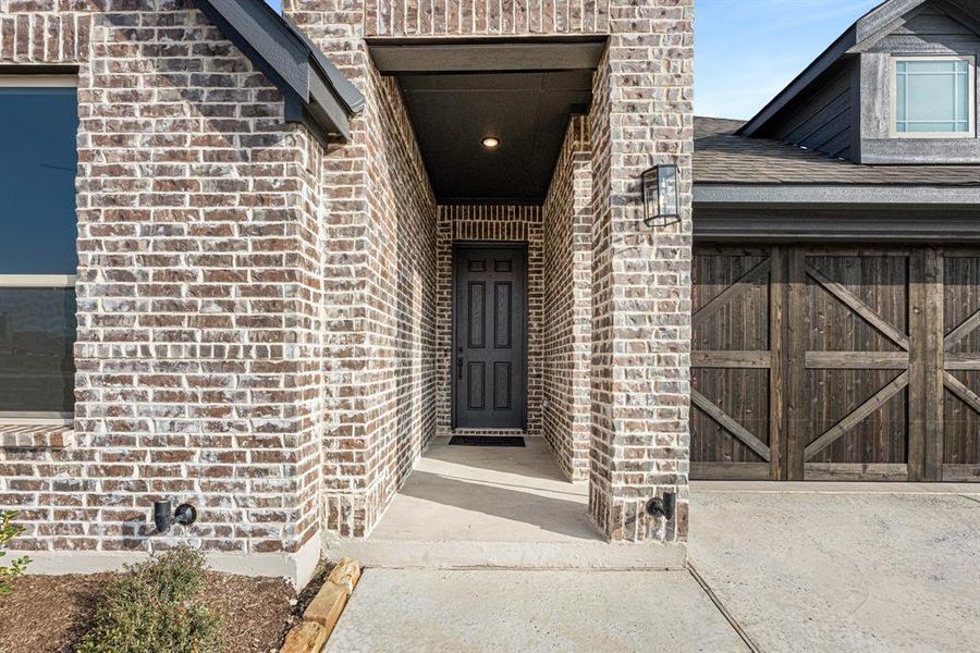 Exterior details and patio area of a home in The Retreat at North Grove 60, Waxahachie (Image 20).