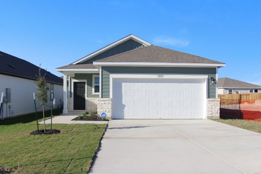 Front exterior of a new home in Eastwood at Sonterra, Jarrell, TX, highlighting curb appeal (Image 1). Front exterior of a new home in Eastwood at Sonterra, Jarrell, TX, highlighting curb appeal (Image 1).