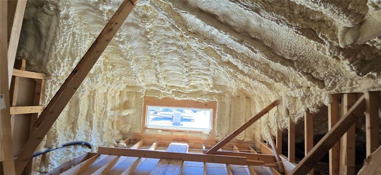 View of attic and spray foam insulation View of attic and spray foam insulation