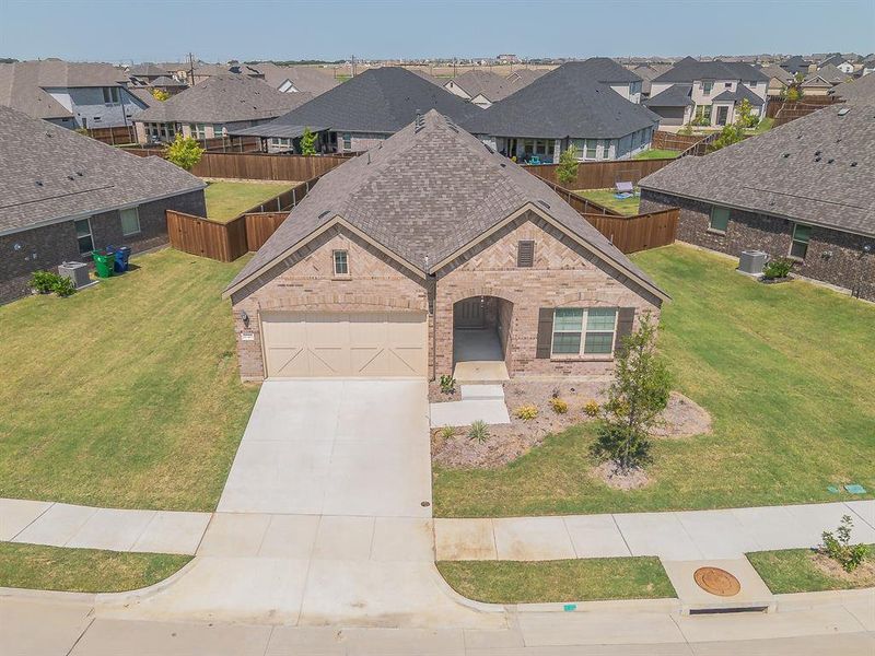 French country style house featuring a residential view, a shingled roof, driveway, and a garage French country style house featuring a residential view, a shingled roof, driveway, and a garage