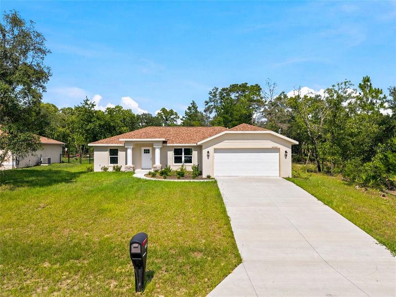 Front exterior of a new home in , Citrus Springs, FL, highlighting curb appeal (Image 17).
