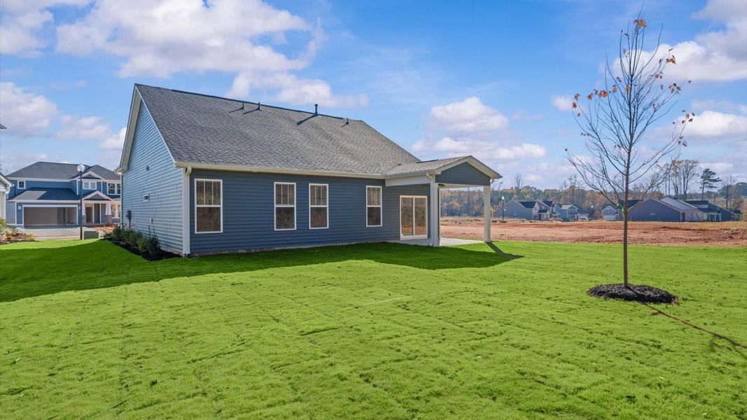Warm and inviting outdoor living space with a covered rear porch and tasteful finishes