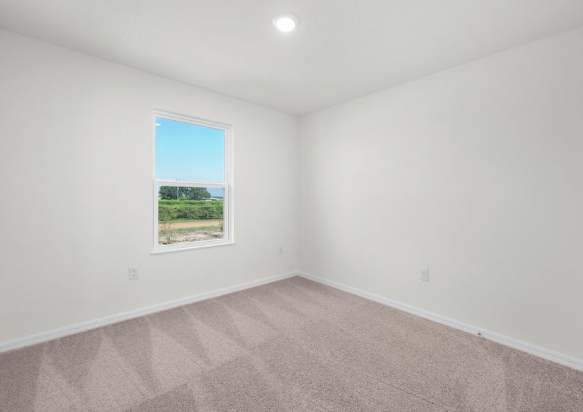 One of three secondary bedrooms that included lush carpeting