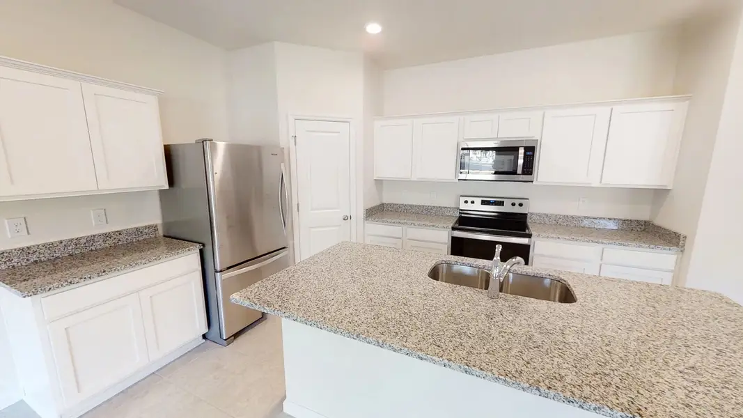 Representative furnished interior of a home built from the Magellan by Starlight Homes in Pelham Square, Deland (Image 5).