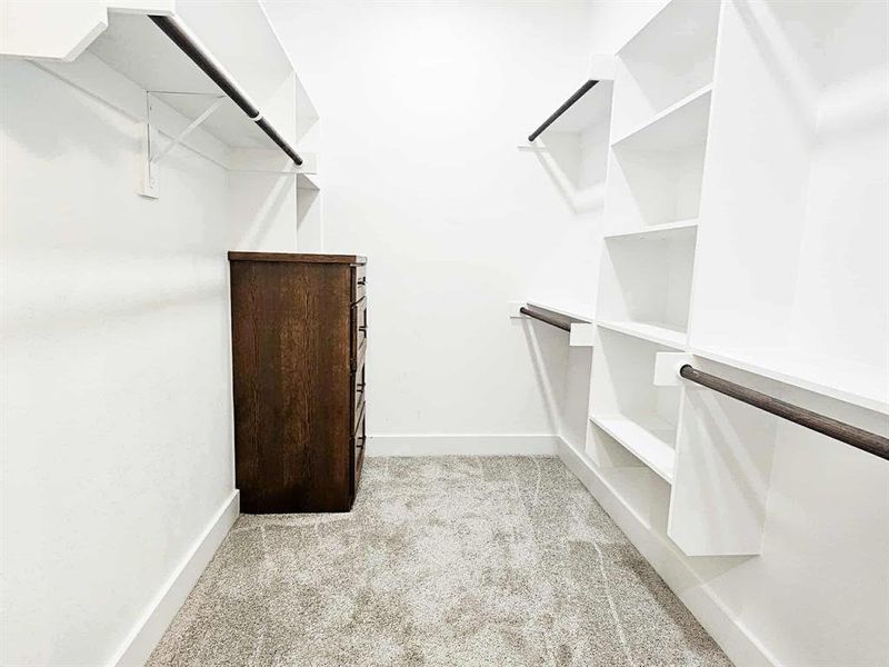 Master closet w/ lots of storage + built in dresser.