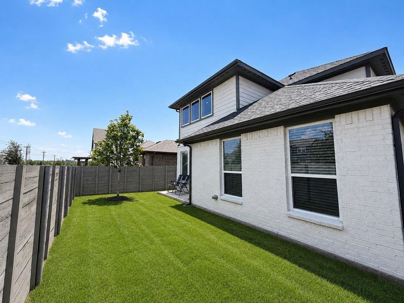 Exterior details and patio area of a home in Harvest, Argyle (Image 3).