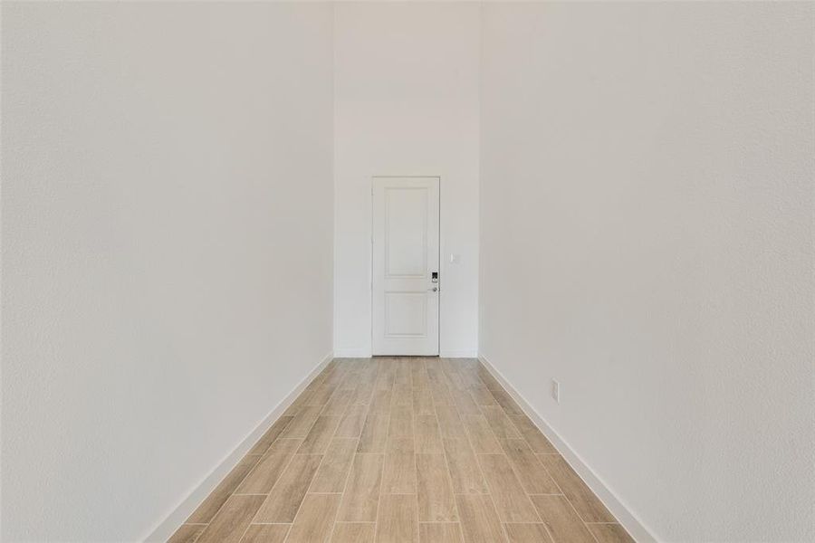 Hallway with light wood-type flooring