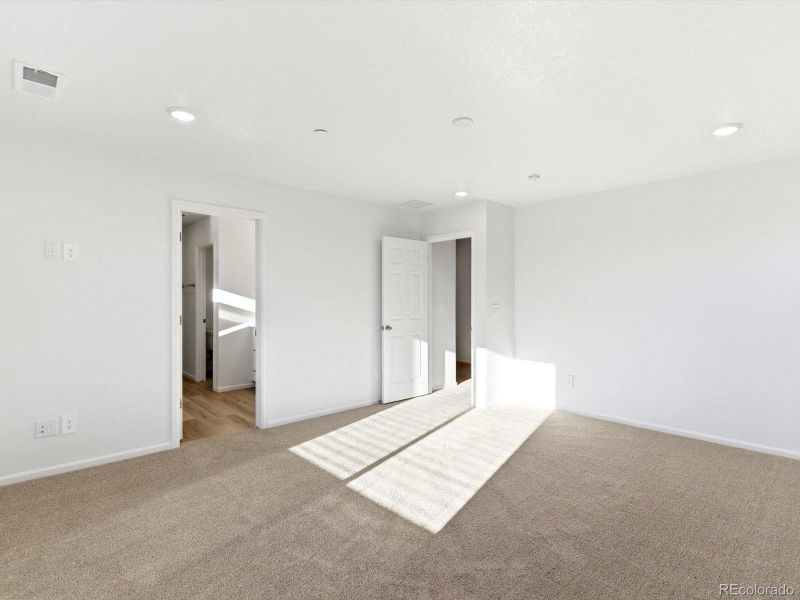 Spacious, unfurnished interior of a new home in Buffalo Highlands: The Flora Collection, Commerce City (Image 21).