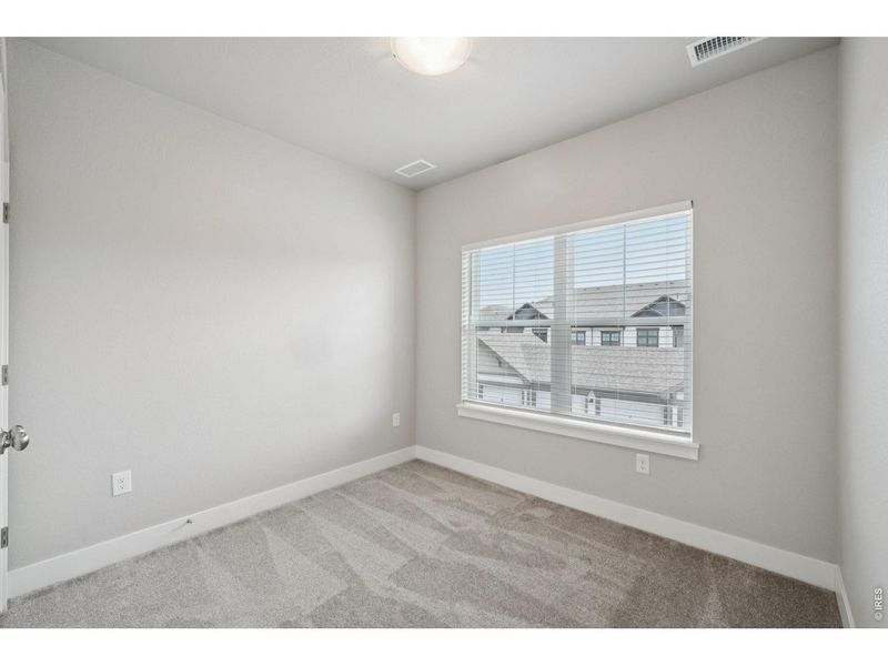 Spacious, unfurnished interior of a new home in Highlands at Fox Hill - The Flats, Longmont (Image 24).