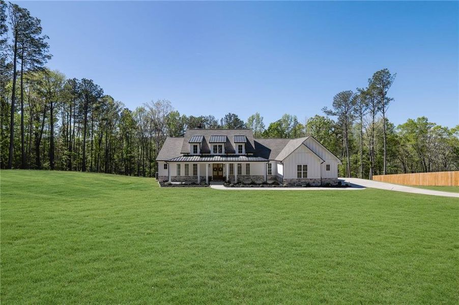 Front exterior of a new home in , Monroe, GA, highlighting curb appeal (Image 27).
