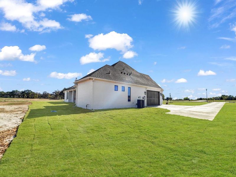 Rear view of house with a yard