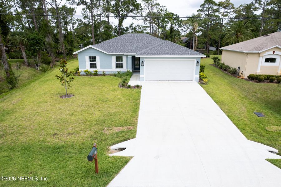 Front exterior of a new home in , Palm Coast, FL, highlighting curb appeal (Image 22).